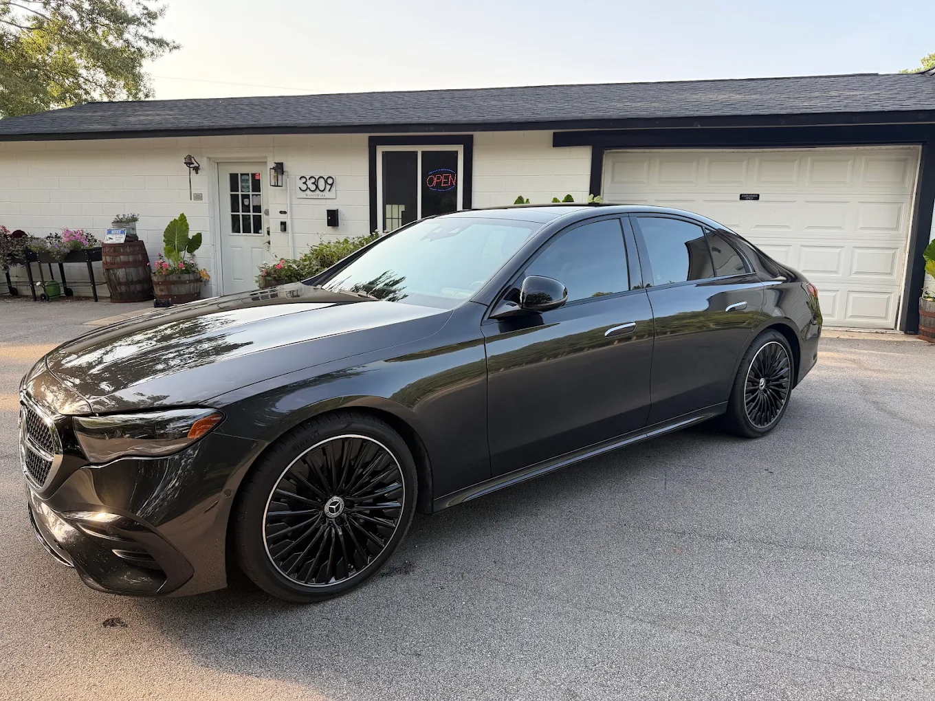 Black Mercedes-Benz sedan with tinted windows at the WashNWerk shop