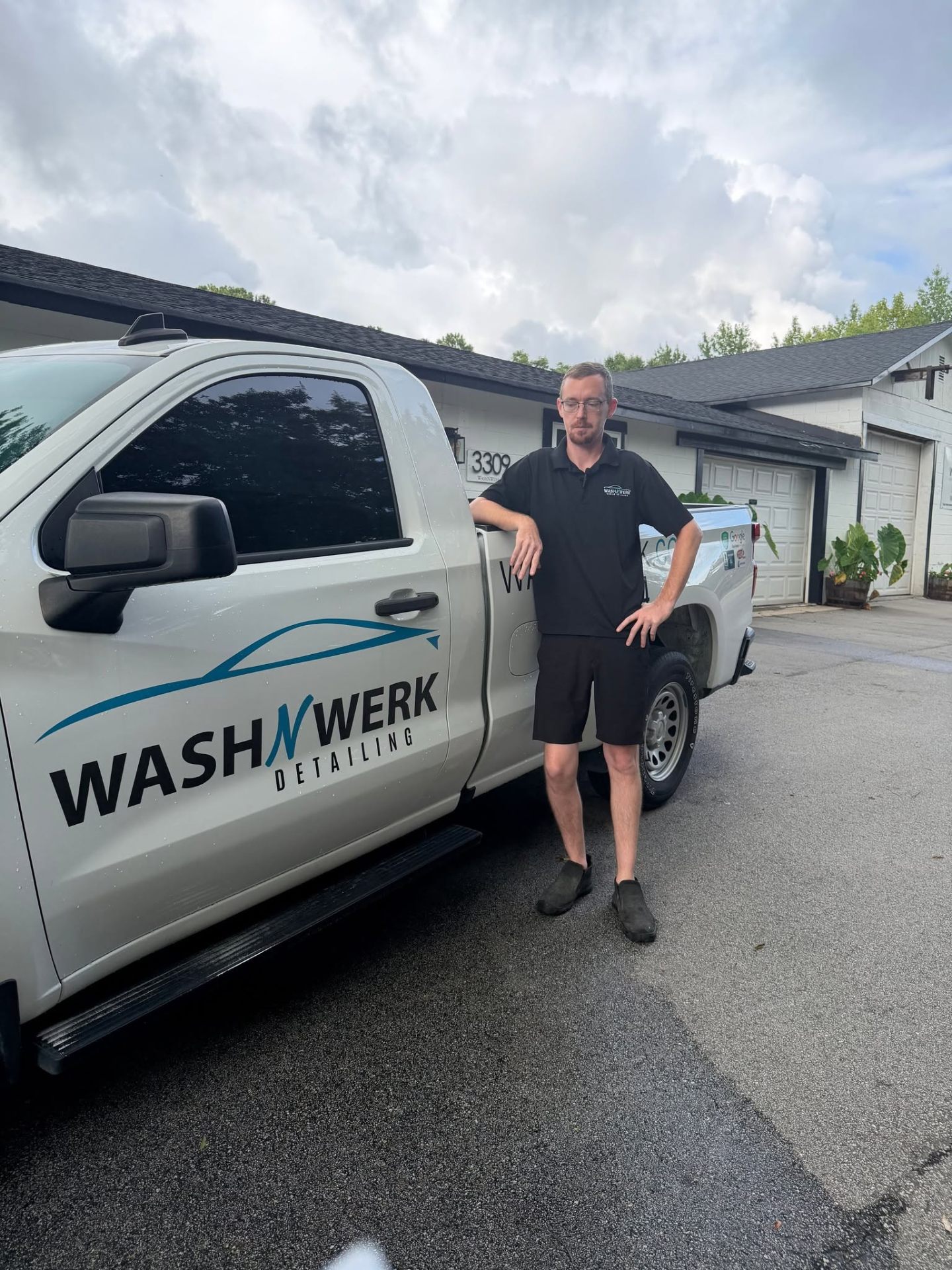 WashNWerk owner beside the branded detailing truck